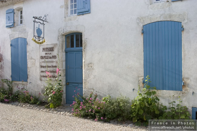 White walls, blue shutters